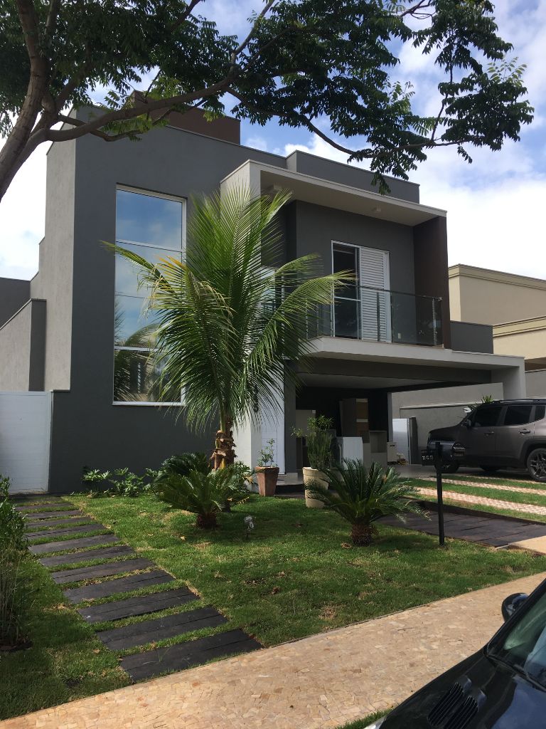 Projeto Paulaskas — fachada contemporânea grafite com jardim frontal · ECOARTT